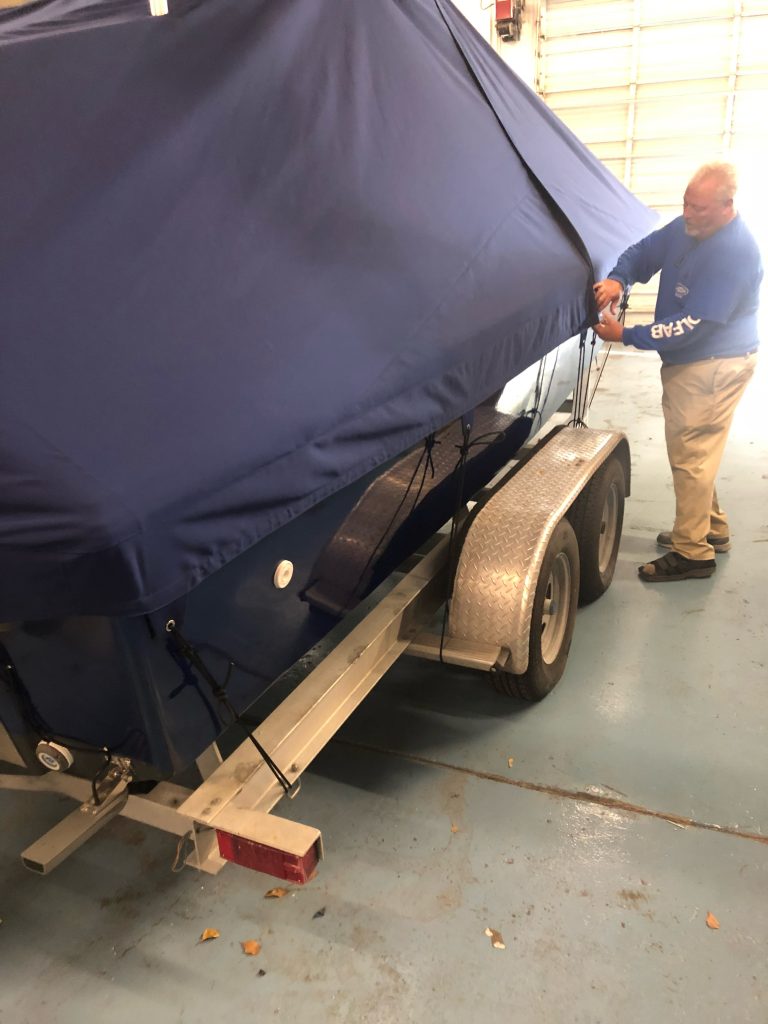 boat stored under tarp